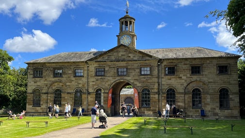 Visitors enjoying the Love Local event and visiting the historic stables building